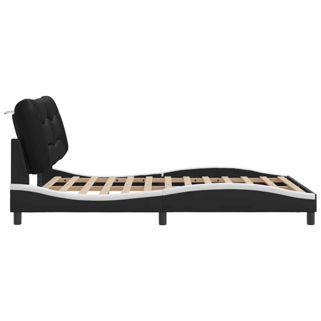 Sengeramme med LED-lys svart og hvit 140x190 cm kunstig lær