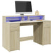 Skrivebord med LED-lys sonoma eik 140x55x91 cm konstruert tre