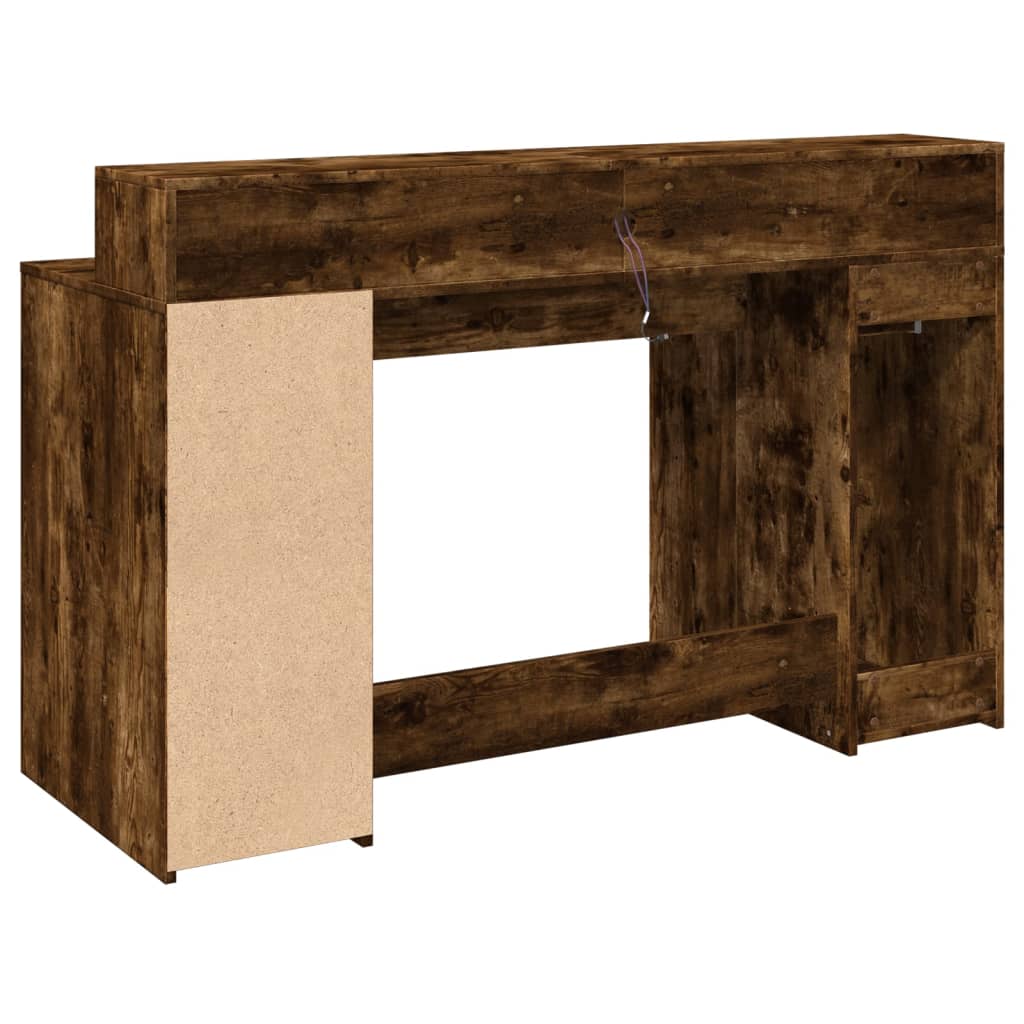 Skrivebord med LED-lys røkt eik 140x55x91 cm konstruert tre