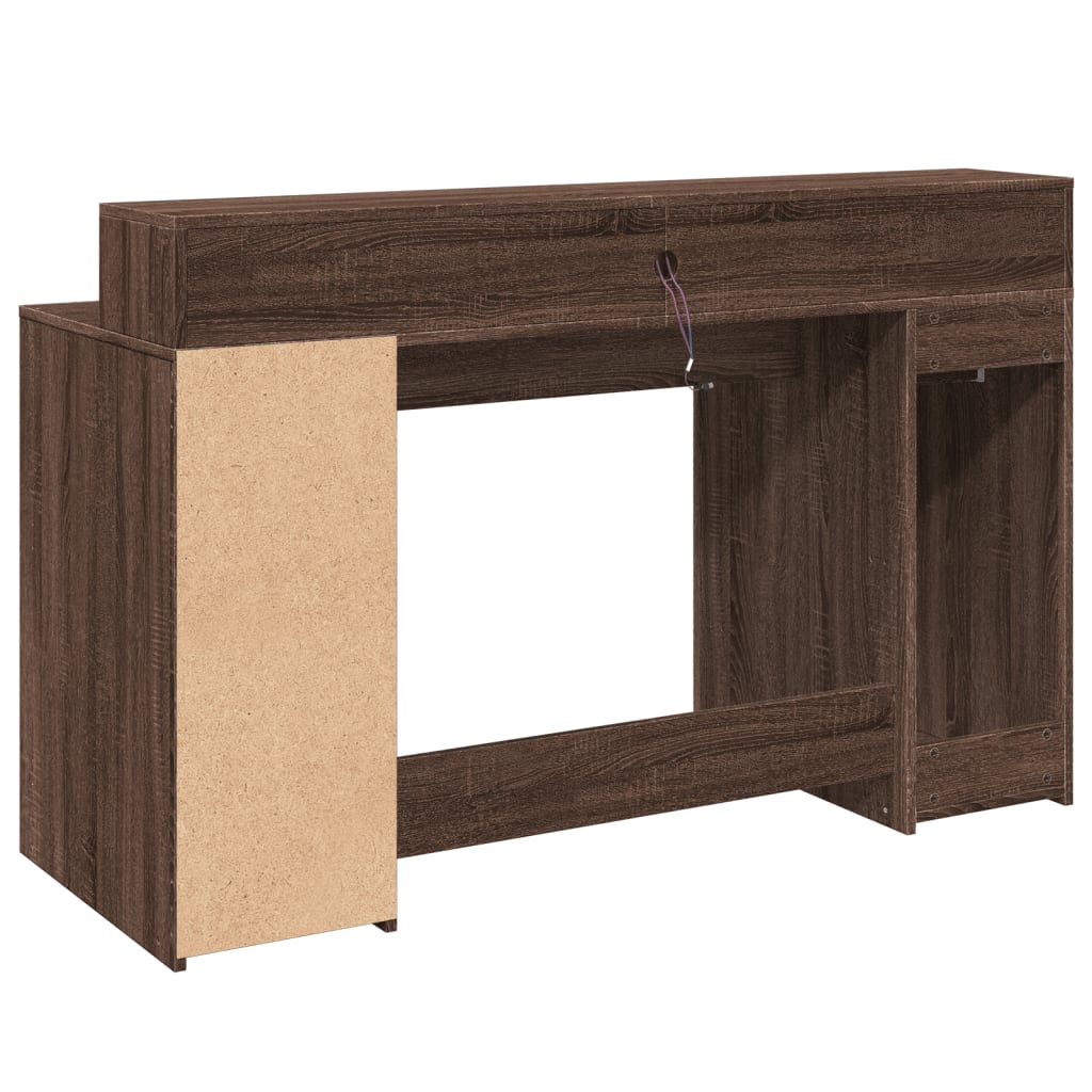 Skrivebord med LED-lys brun eik 140x55x91 cm konstruert tre