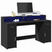 Skrivebord med LED-lys svart 160x55x91 cm konstruert tre